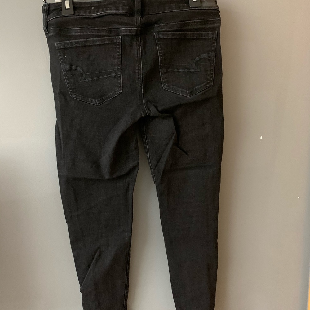 Black American Eagle jeans.